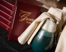 A hymnal and pitcher with towel