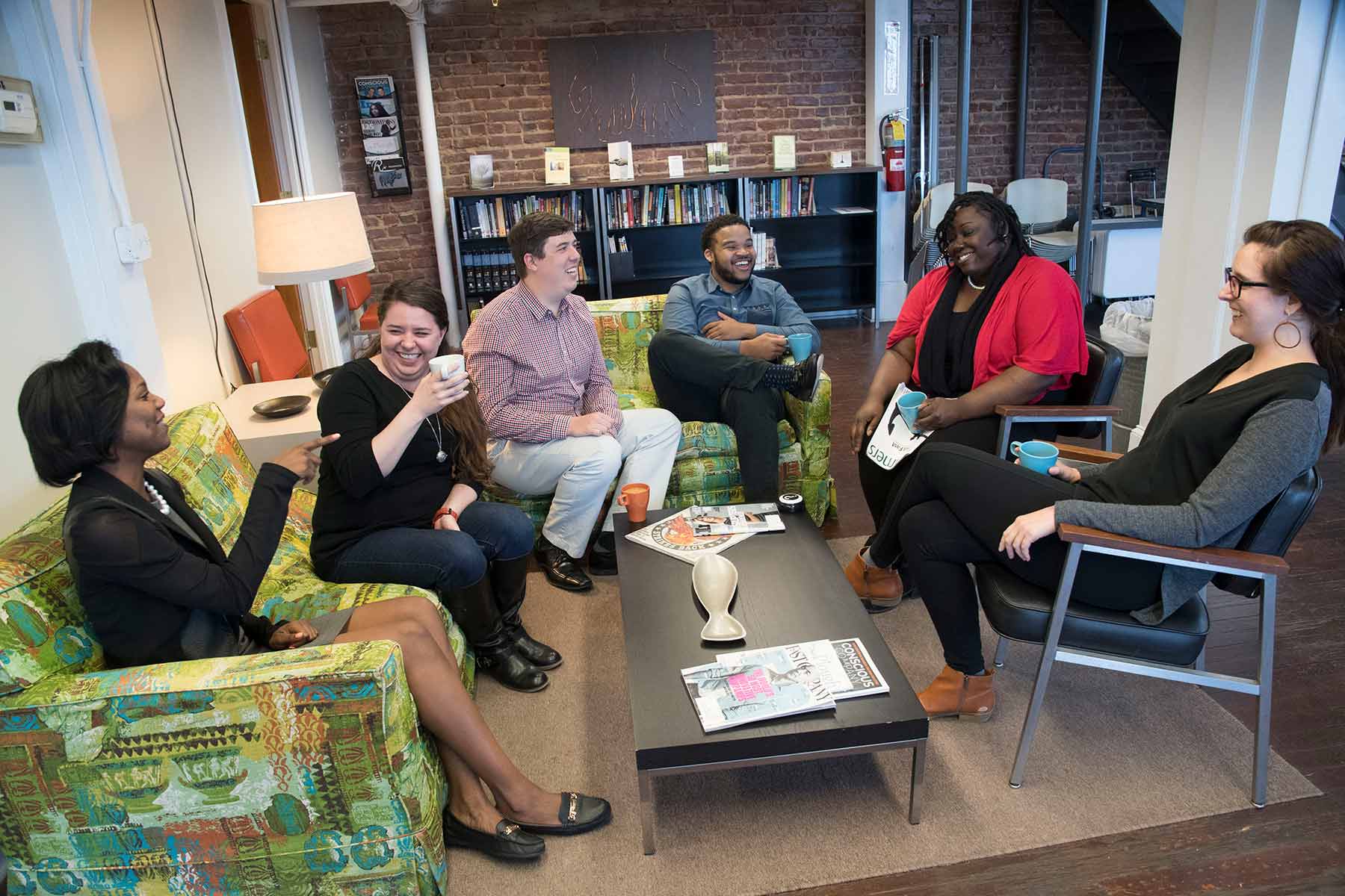 A group of students sitting in a circle talking