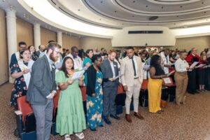New and returning Theology students gather and sing with faculty, staff, and friends during the annual Founders Day service in Day Hall.